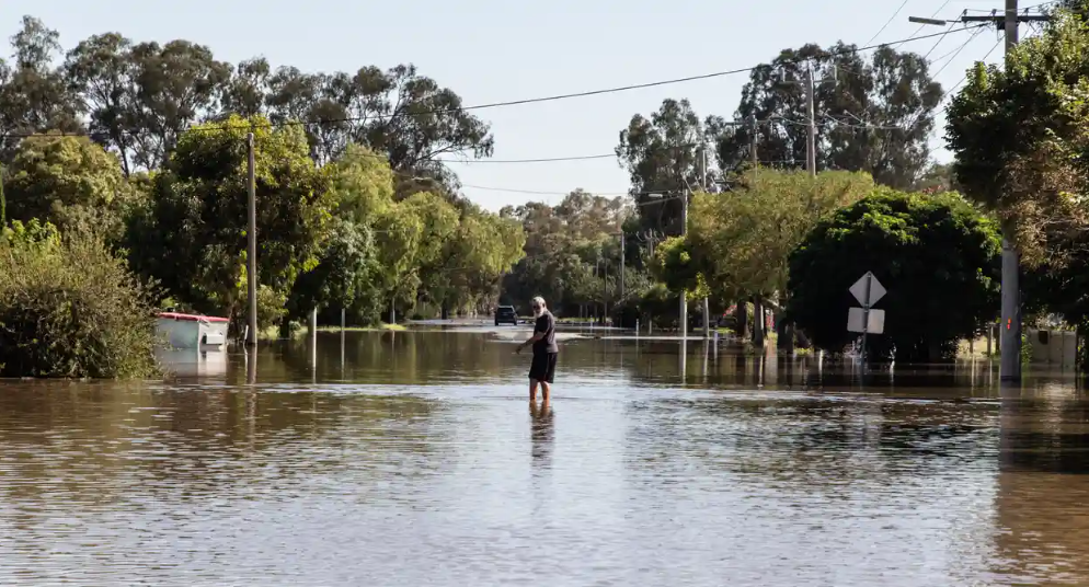 A flooded street in Rochester, Victoria, this month. Weather forecasters and warning services are experimenting with artificial intelligence to aid in predicting and warning of extreme events. Photograph: Diego Fedele/Getty Images